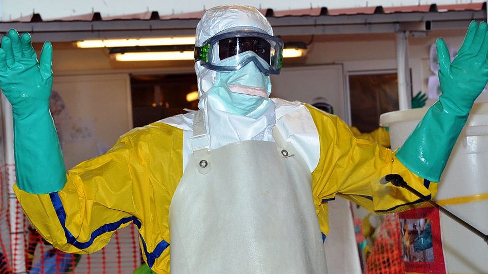 An Ebola worker in Guinea - archive