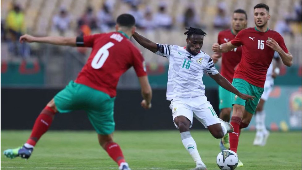 Ghana forward Paintsil Joseph dey hold possesion during di match wit Morocco