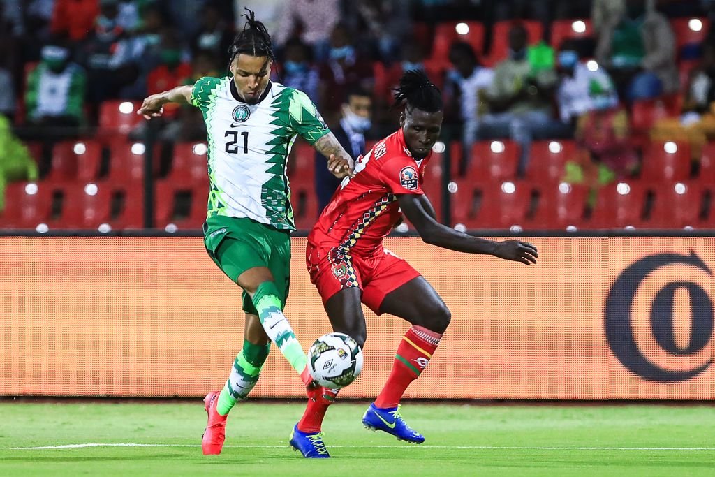 Nigeria defender Tyronne Ebuehi ight for di ball wit Guinea-Bissau forward Piqueti
