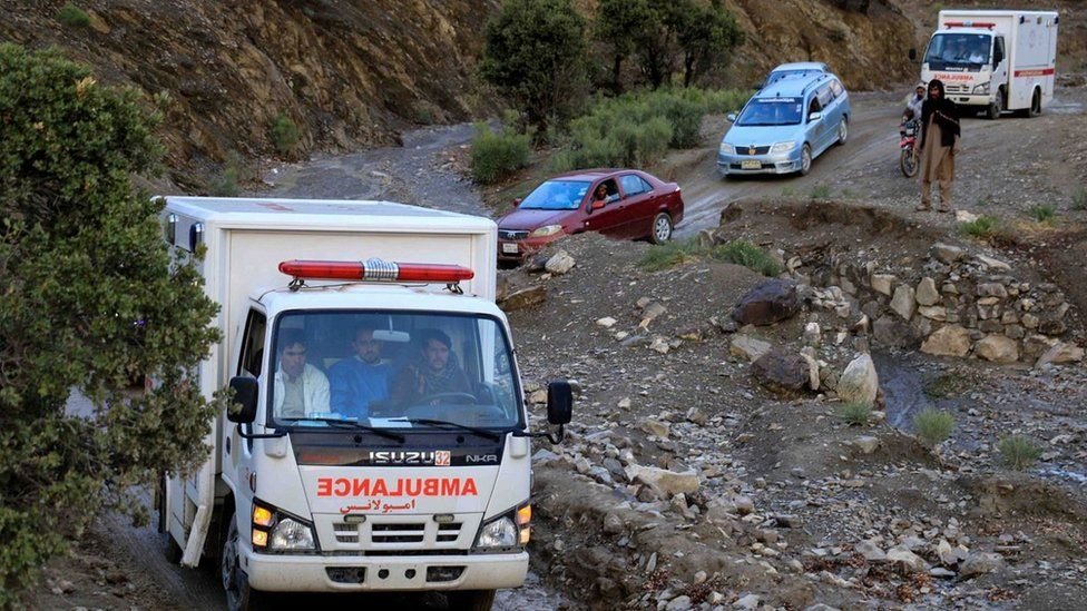 Ambulance convoy transport victims of di earthquake for Gayan village by navigating through rocky terrain