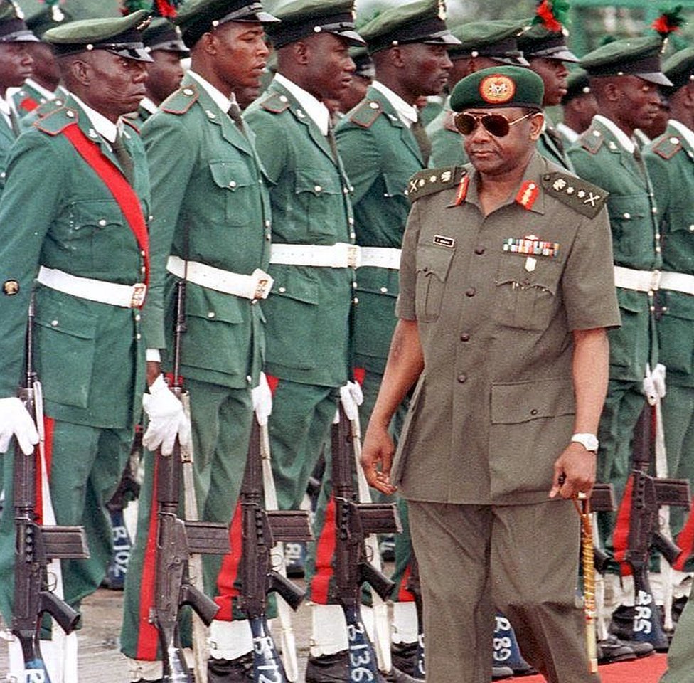 Sani Abacha for airport of Abuja in front of soldiers around 1996