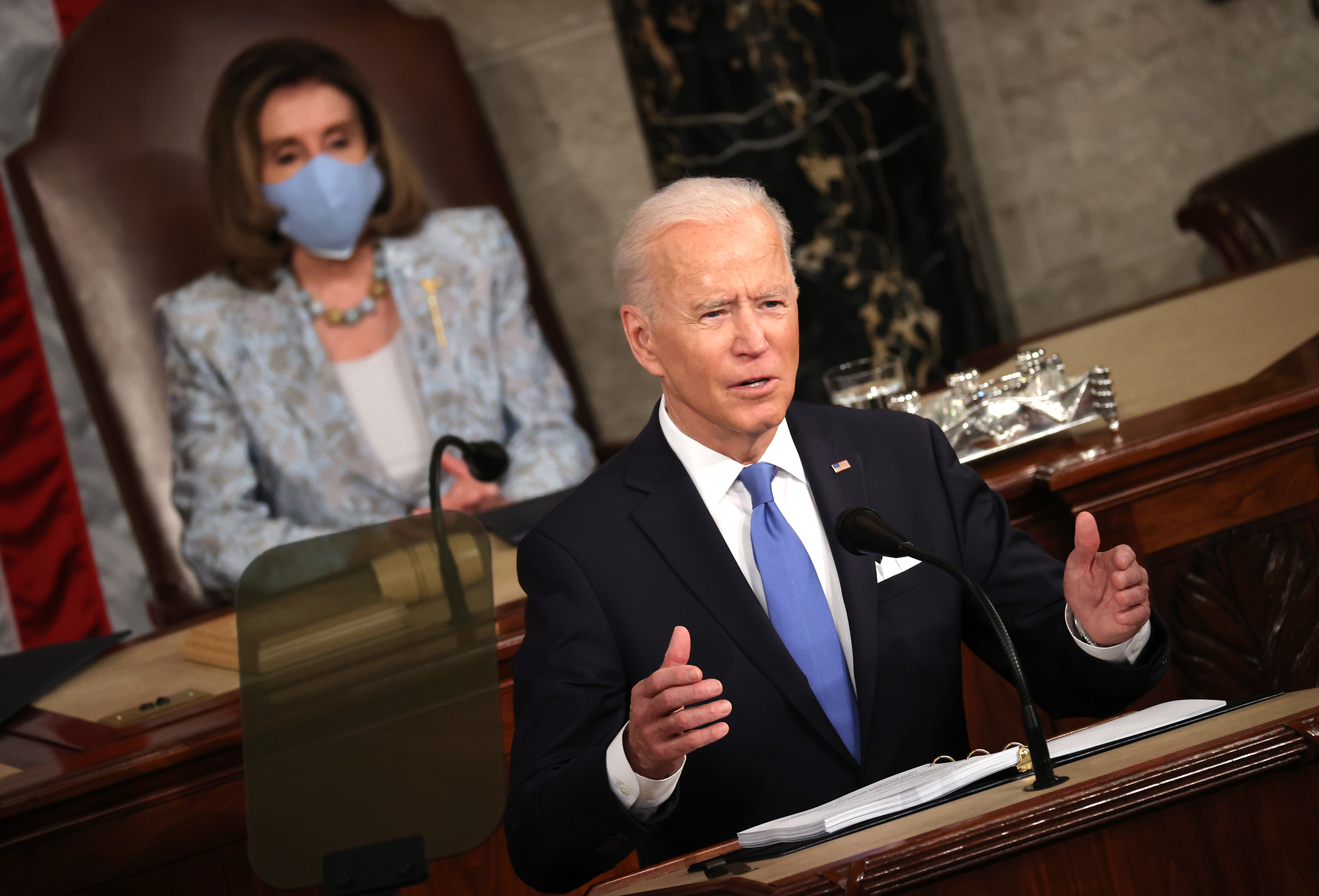 America President Joe Biden wit speaker of di House of Reps, Nancy Pelosi (background)