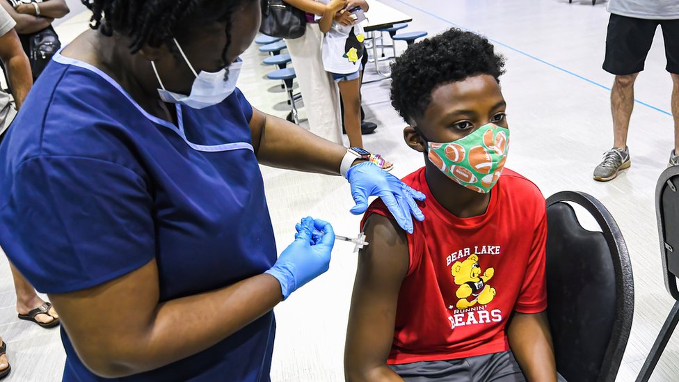 A child is vaccinated in Florida