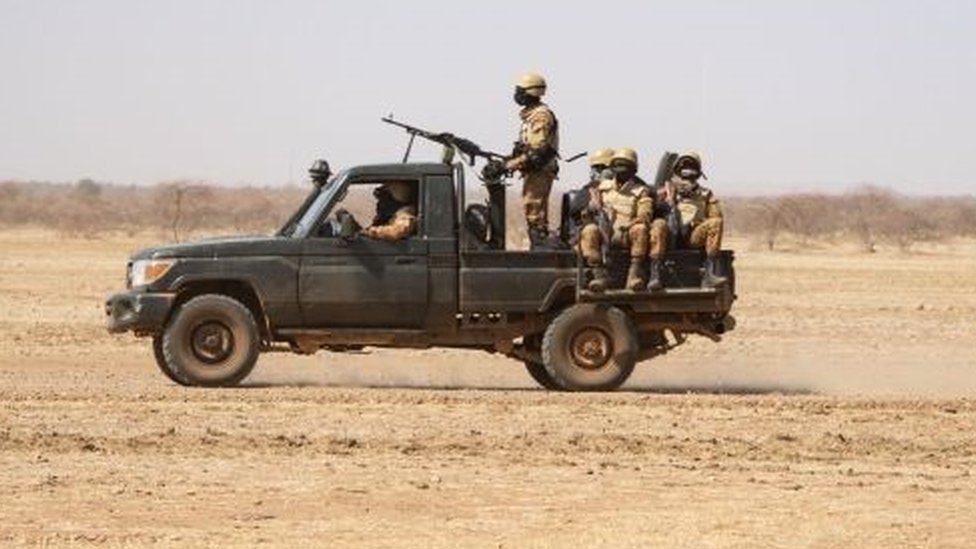 Burkina Faso sojas dey patrol ontop one pick-up truck on di road from Dori to di Goudebo refugee camp, on February 3, 2020