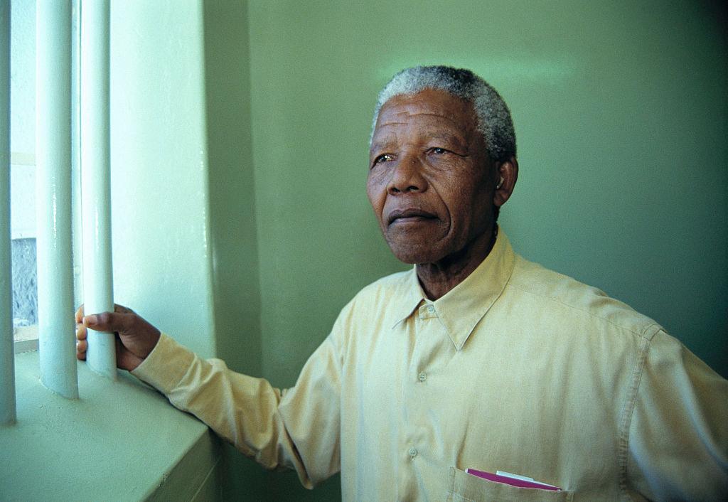 Nelson Mandela revisit di cell for Robben Island prison where dem for jail am for more than two decades