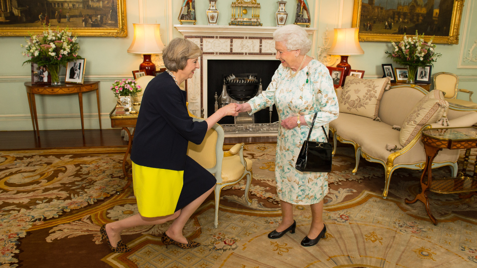 Theresa May and  Queen 