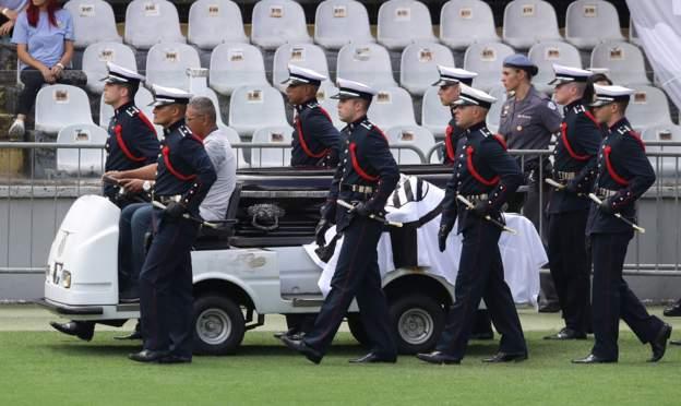 Members of military carri Pele coffin from di Santos stadium