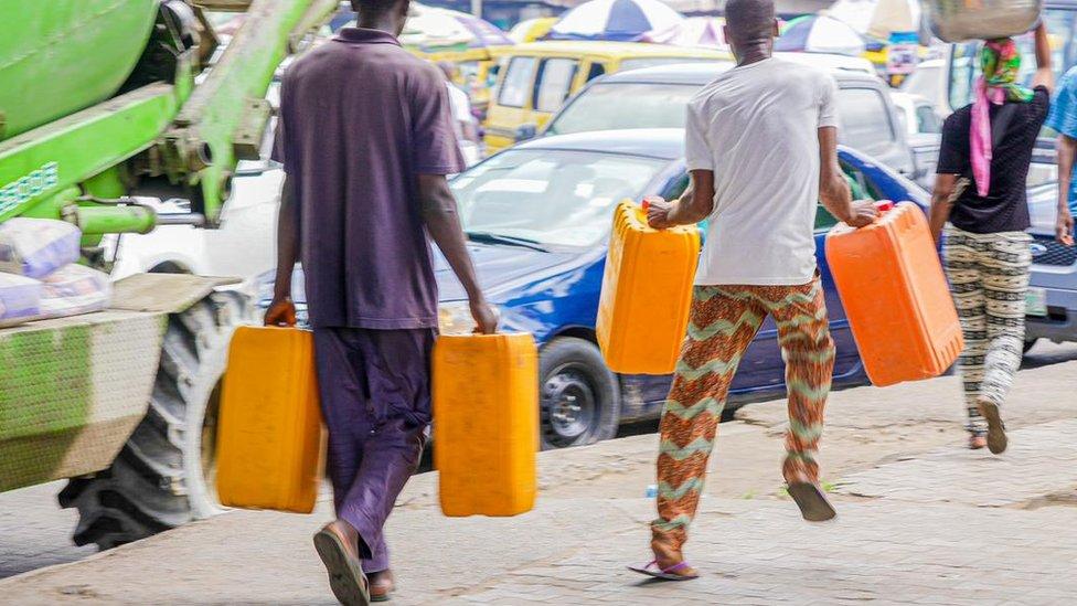 Two pipo carry jerrycan dey find fuel