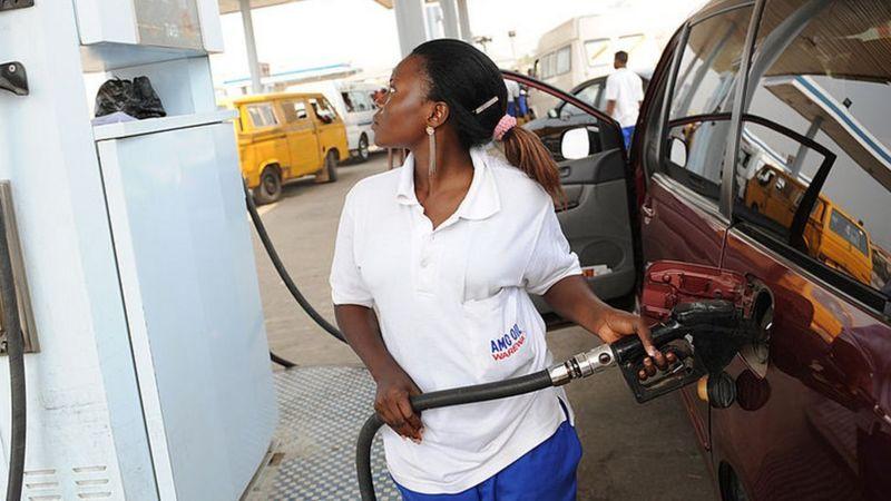 Female fuel attendant in Africa