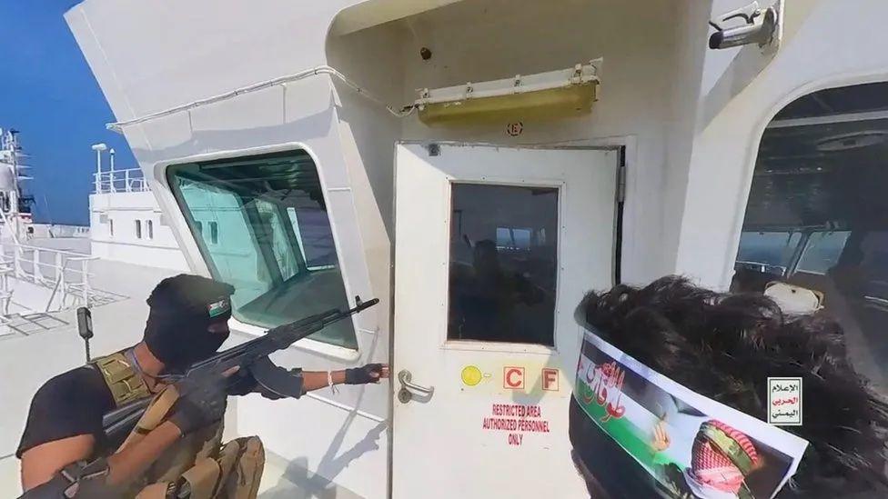 Armed Houthi rebels open di door for deck of one ship