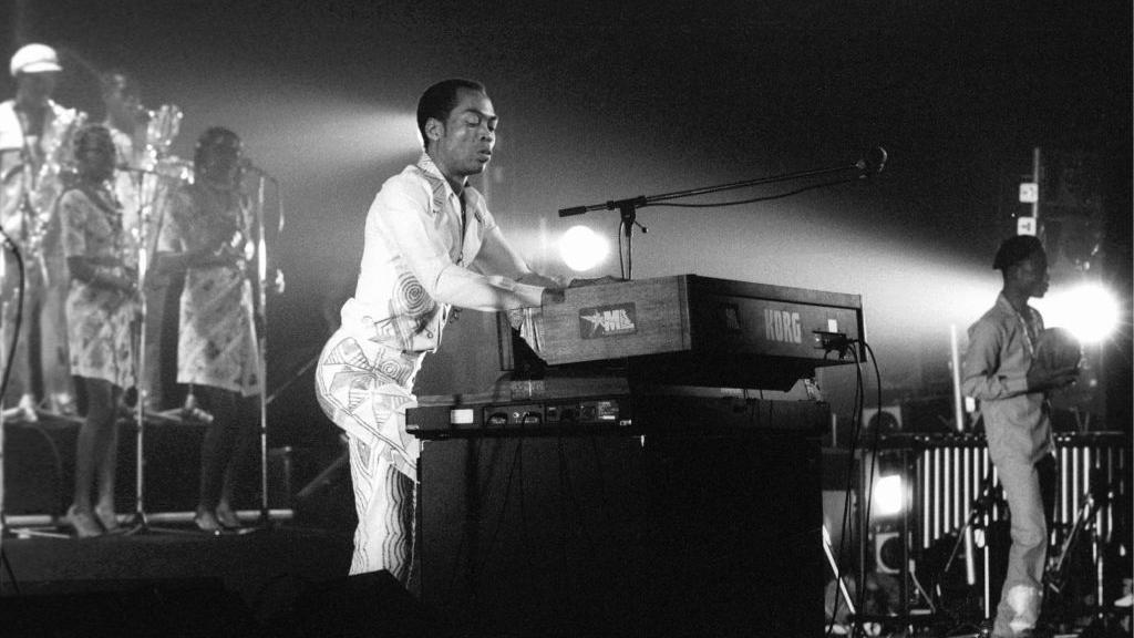 Fela Kuti on stage playing keyboard