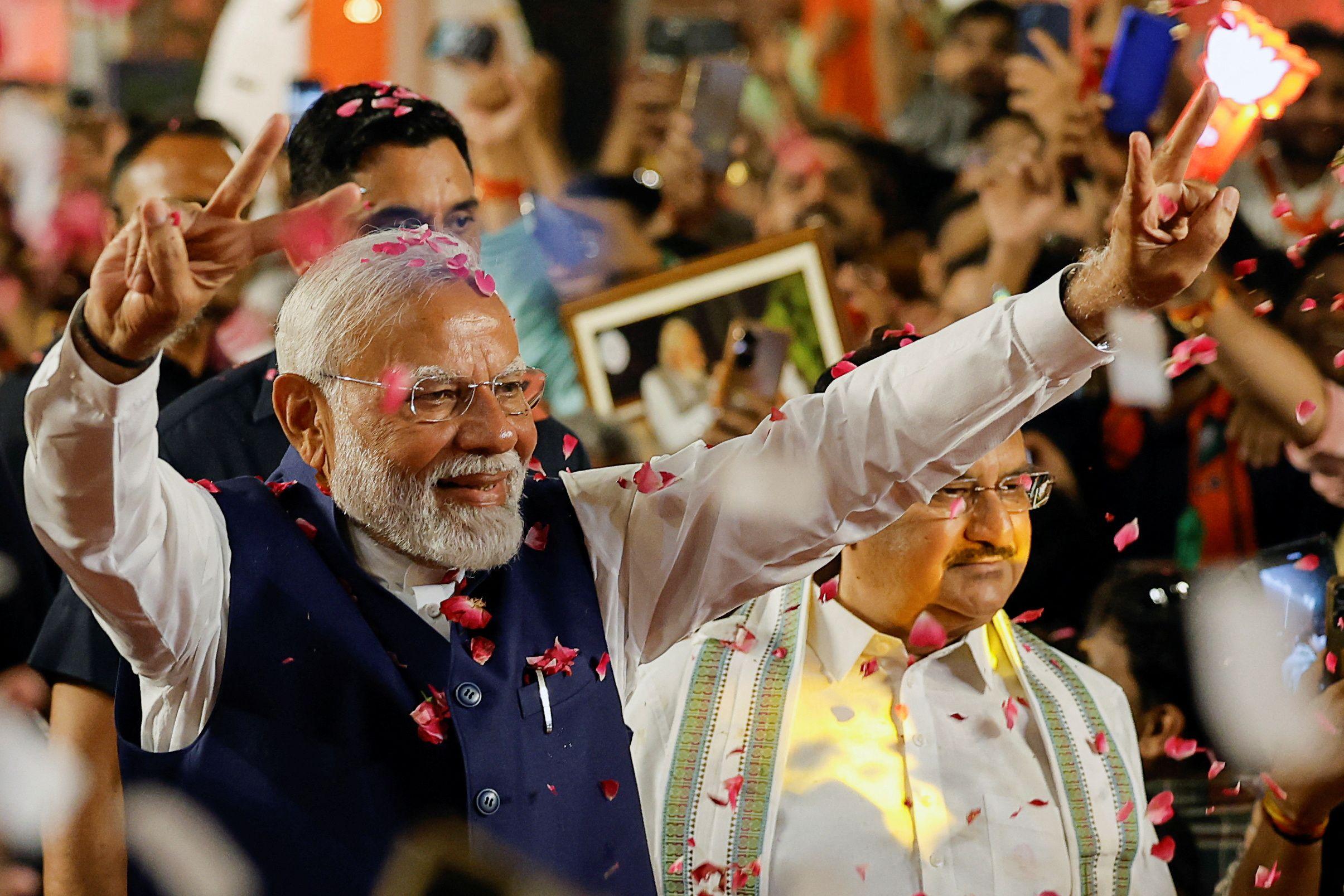 Indian Prime Minister Narendra Modi gesture as e land for di Bharatiya Janata Party (BJP) headquarters for New Delhi, India