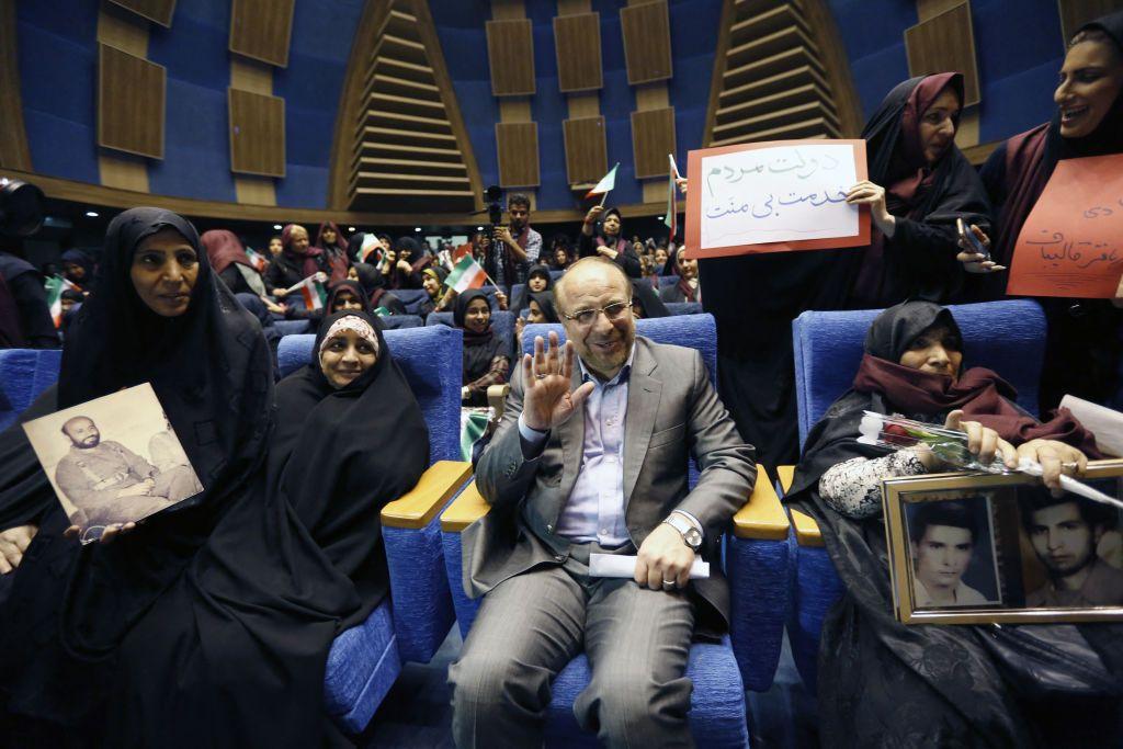 Iranian conservative presidential candidate and Tehran mayor Mohammad Bagher Ghalibaf (C) wave as im sit among supporters during a campaign rally in di Iranian capital Tehran on May 14, 2017. 