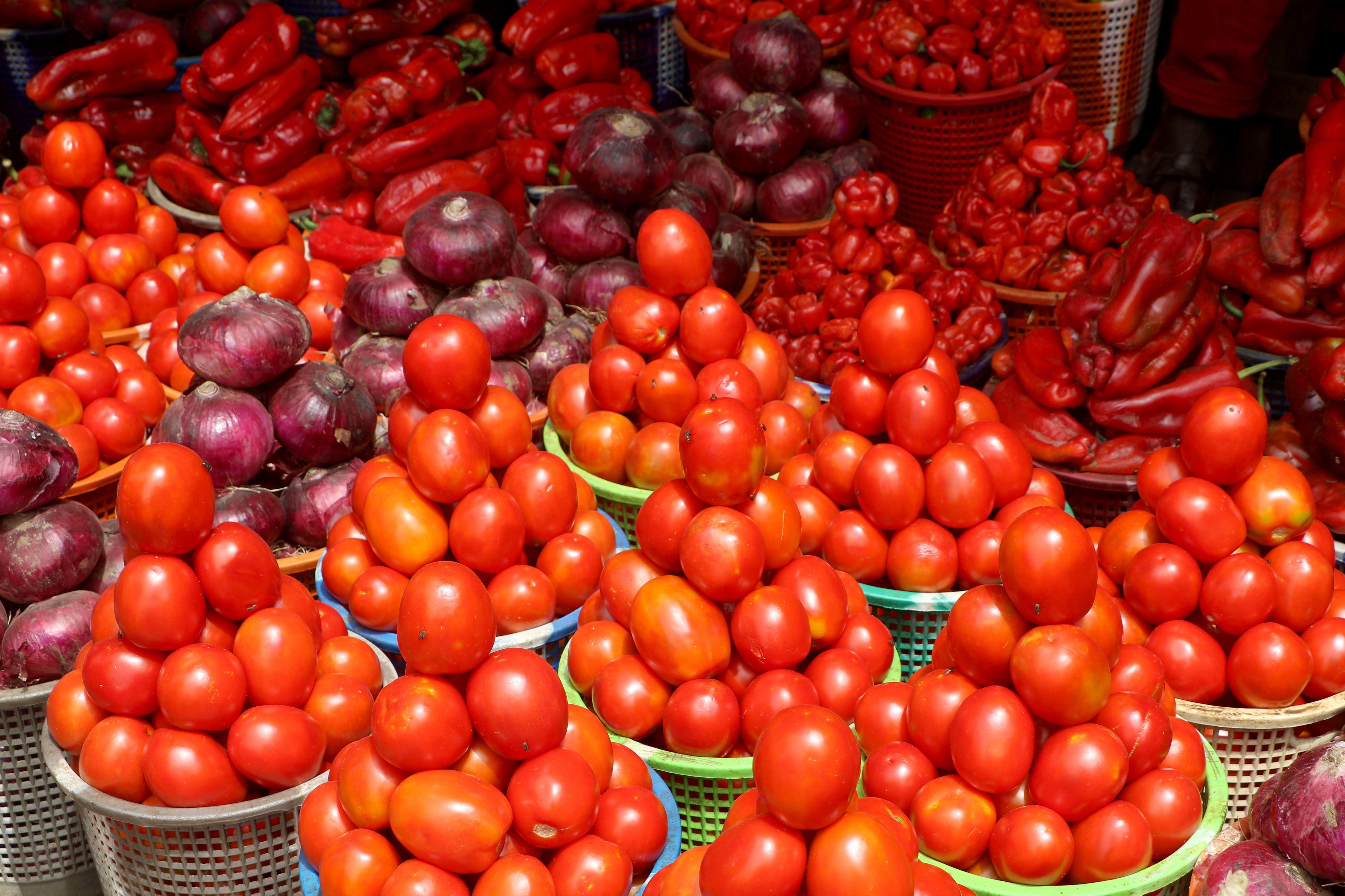 A stack of tomatoes, onions and pepper