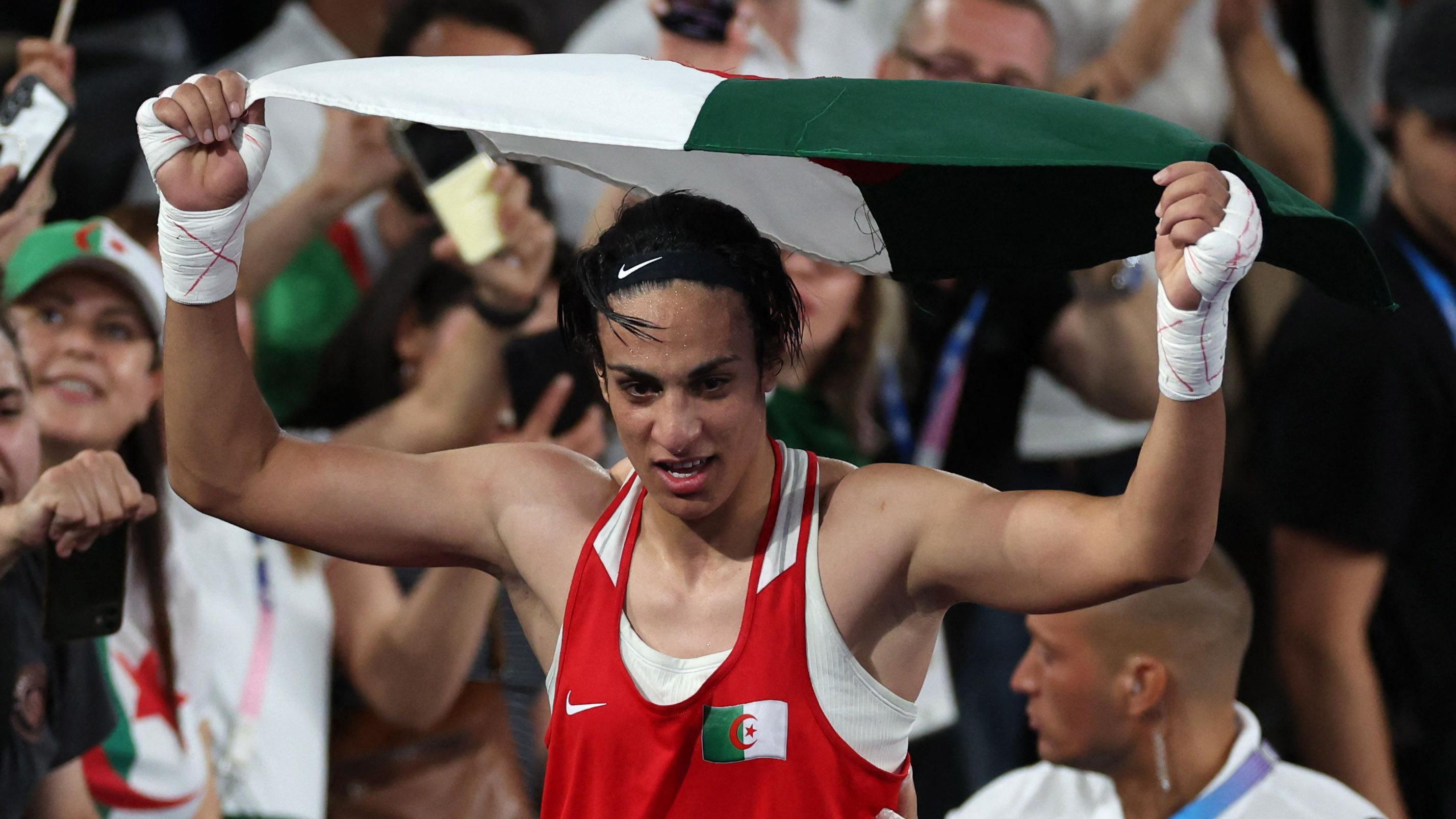 Khelif holds Algerian flag