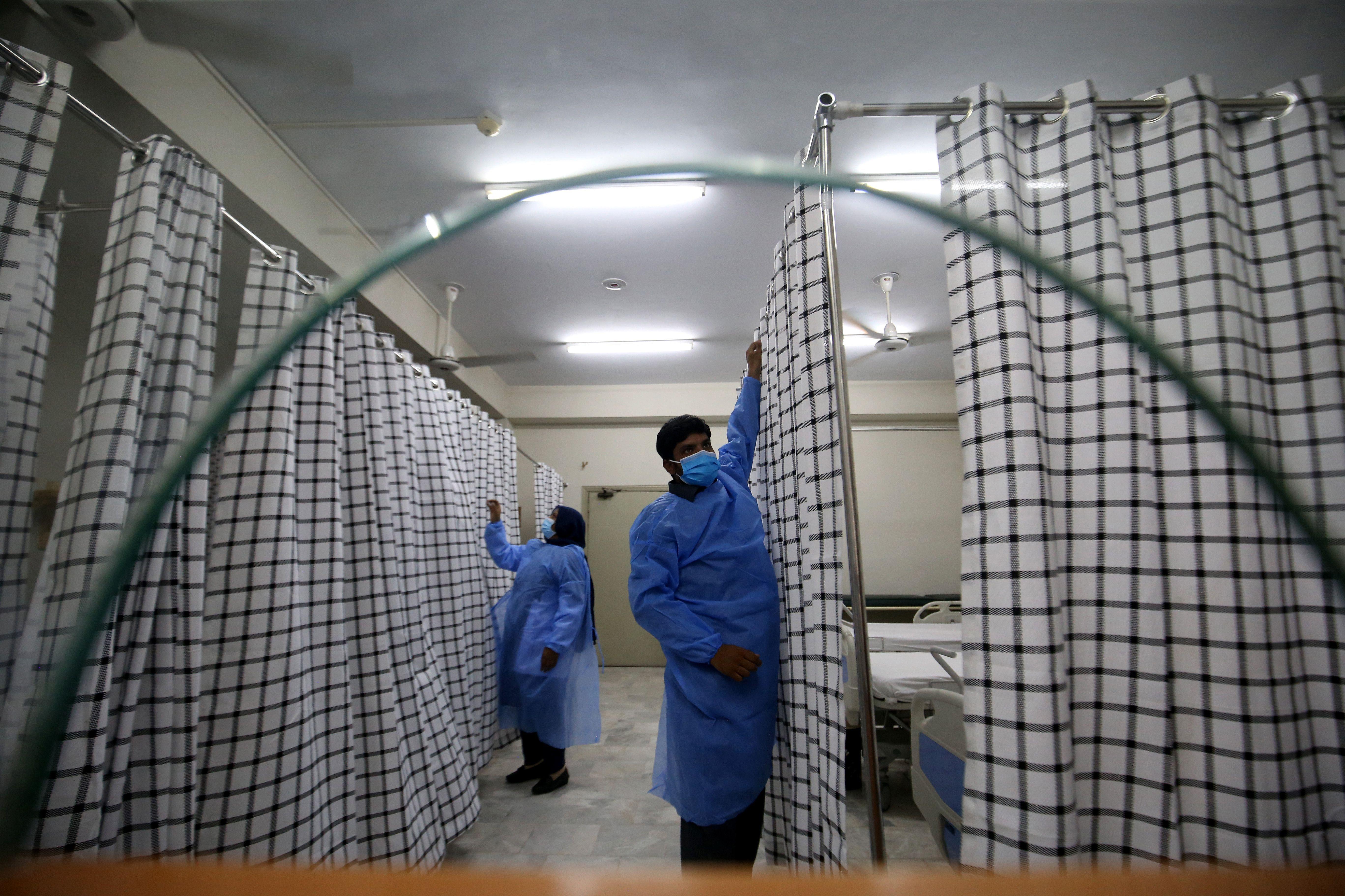 Hospital staff work at a ward at the Police & Services Hospital, which has been converted to be used as an isolation ward for mpox patients, in Peshawar