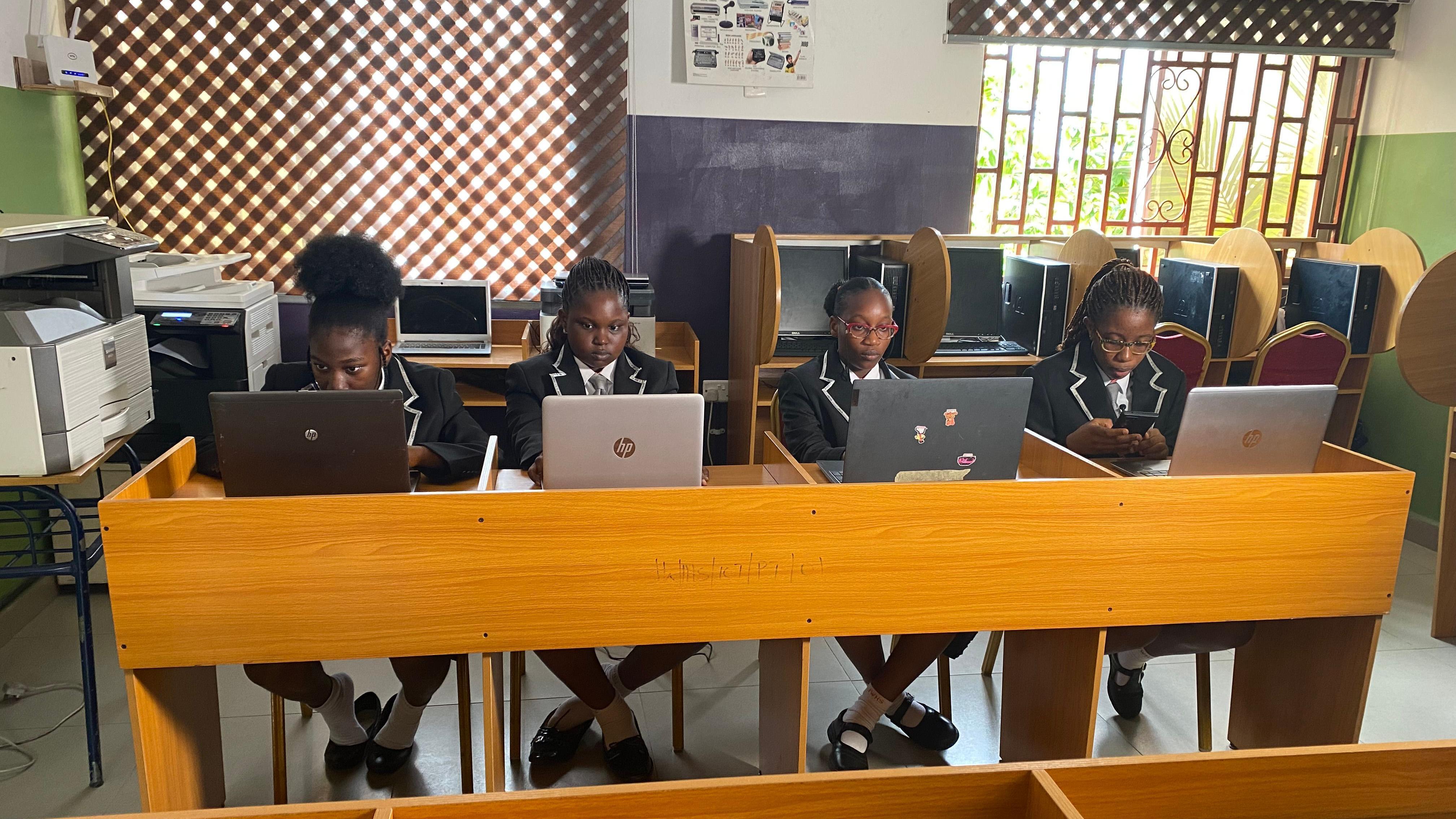 Four young secondary school girls