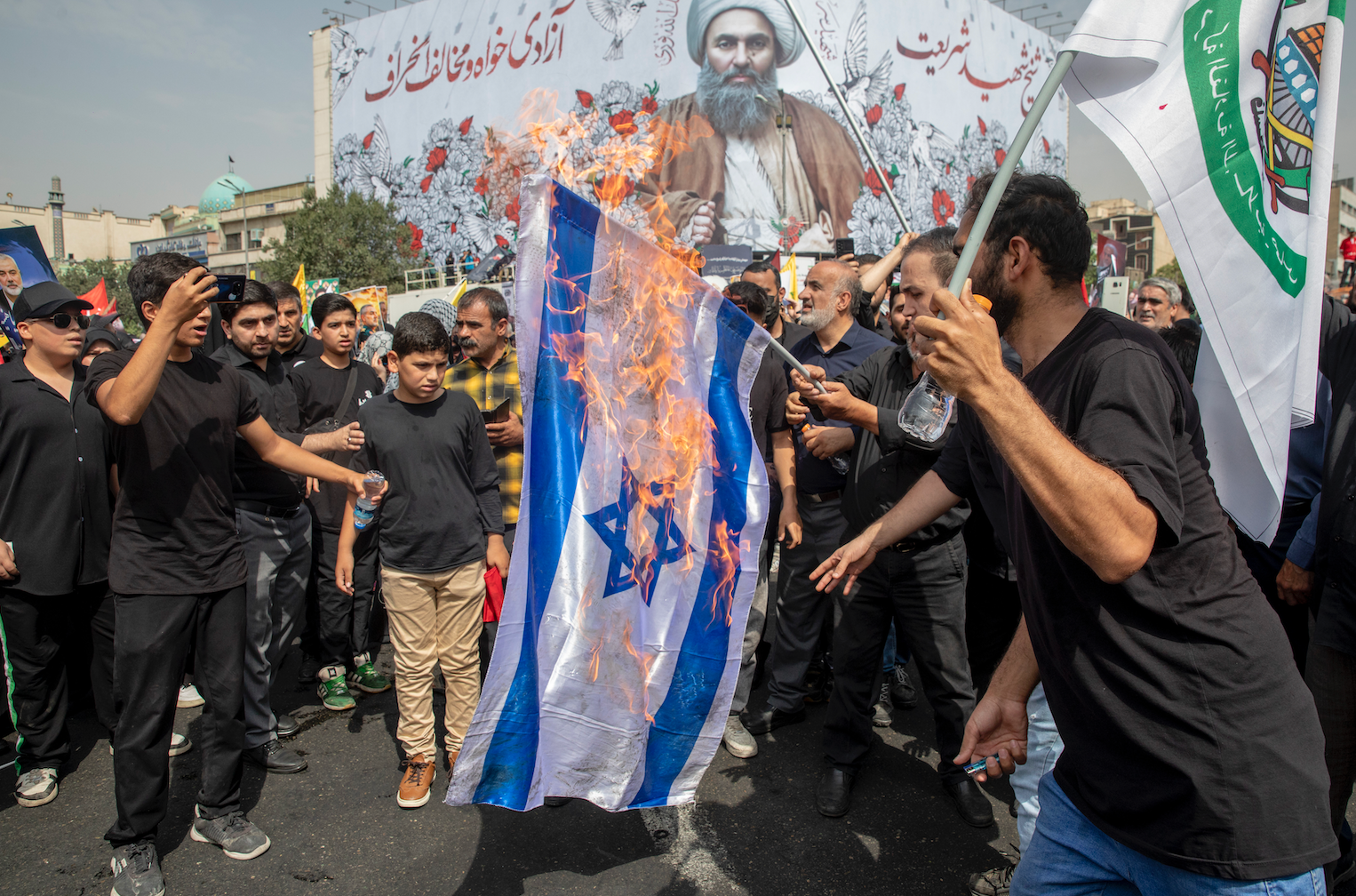 Protesters burn Isreal flag during Hamas leader funeral for Iran