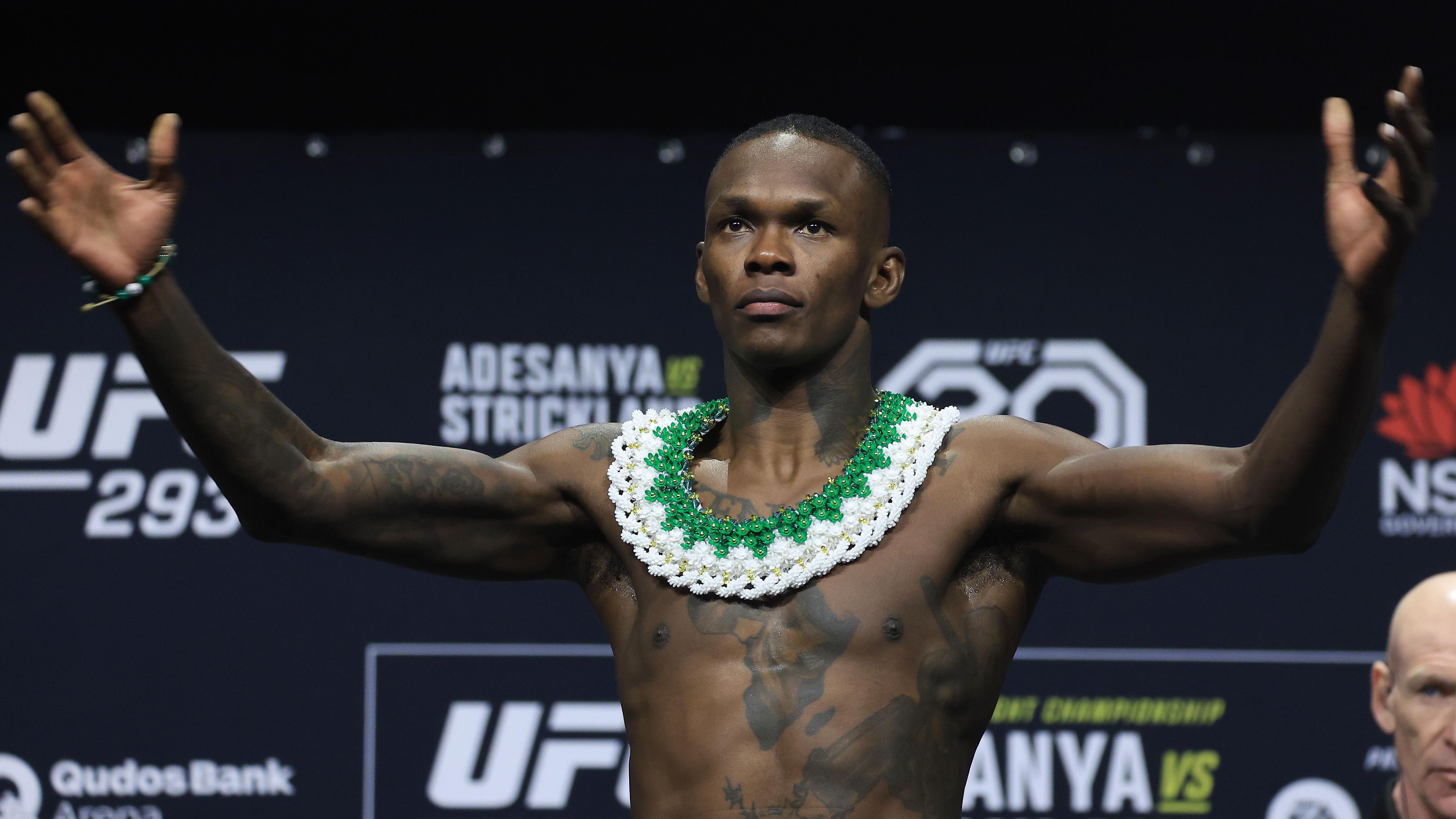 Israel Adesanya pose for a weigh-in ahead of UFC 293