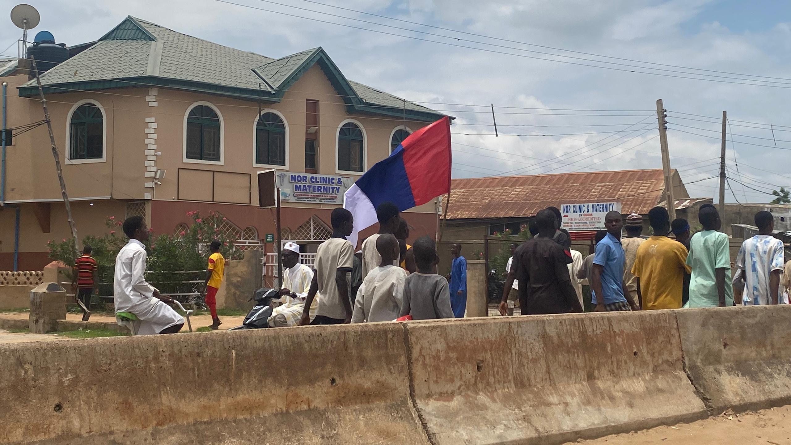 Protesters carrying Russian flag