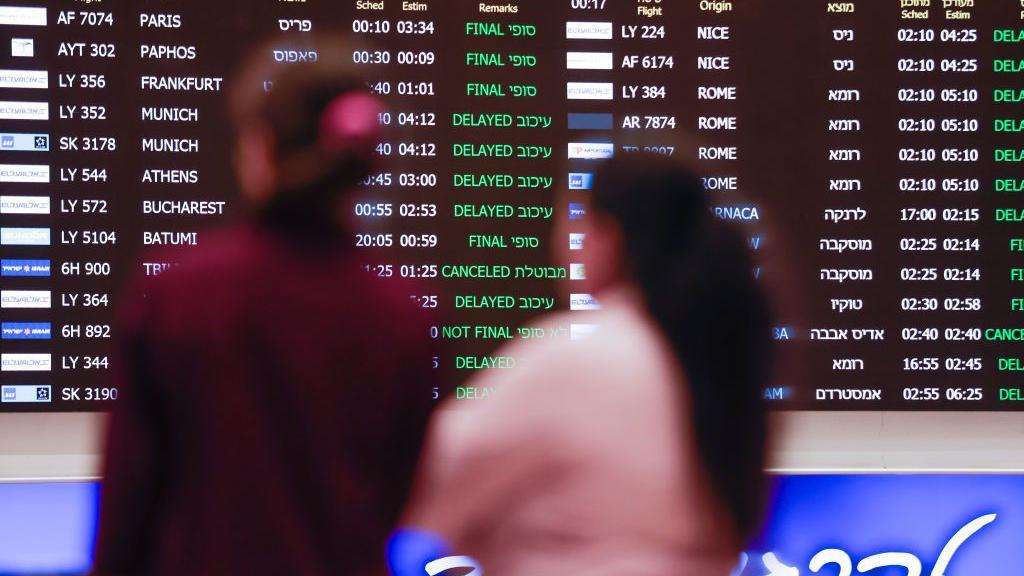 A departure board in Ben Gurion International Airport in Lebanon showing many delayed flights to different destinations.