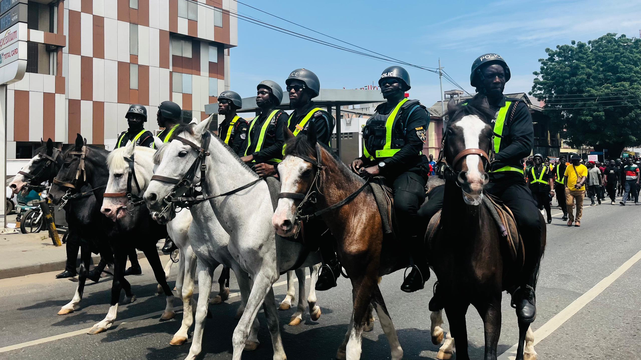 Police officers in dia uniforms as dem monitor di protest for Ghana 