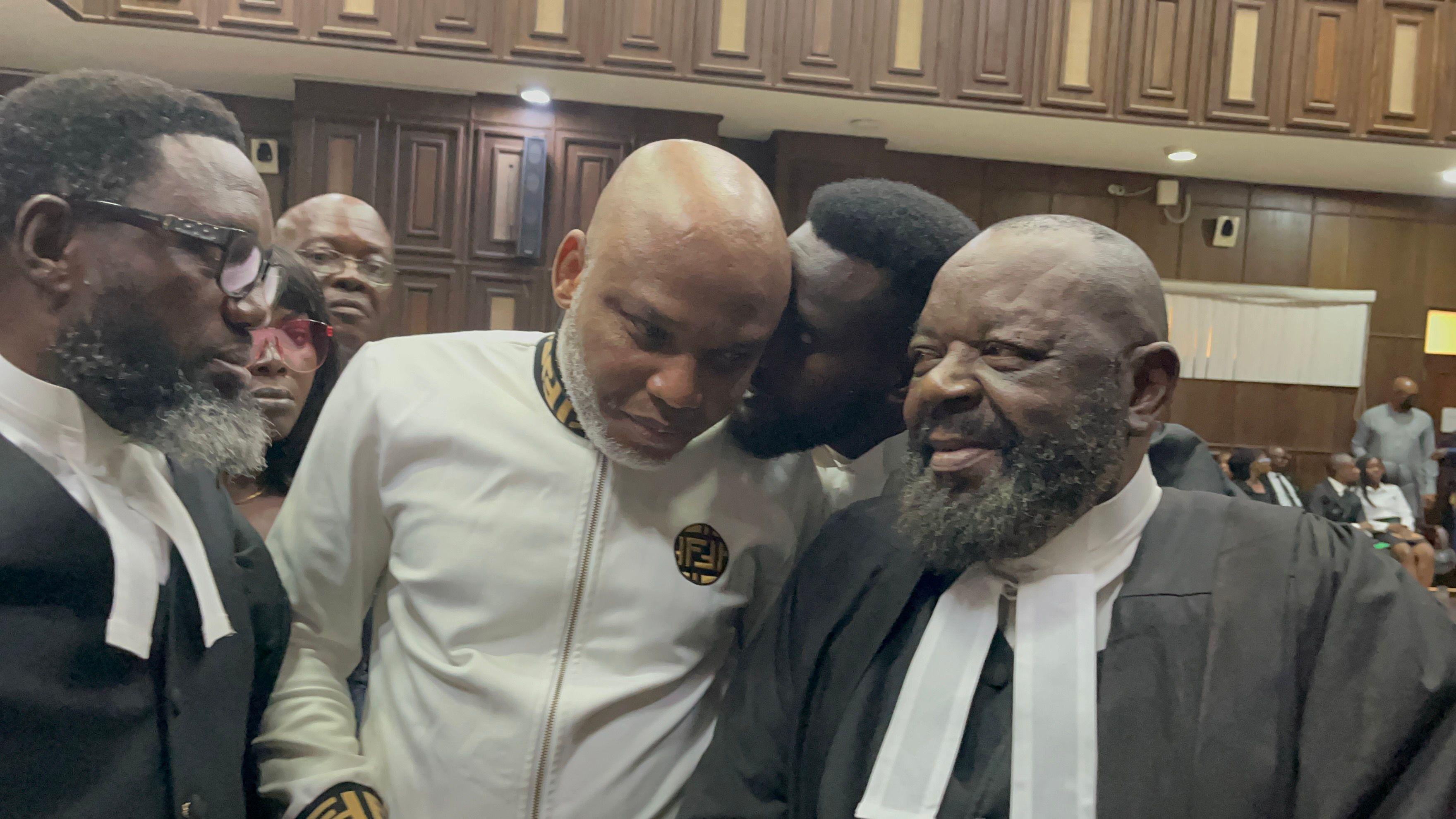 Nnamdi Kanu and his lawyers talking in court