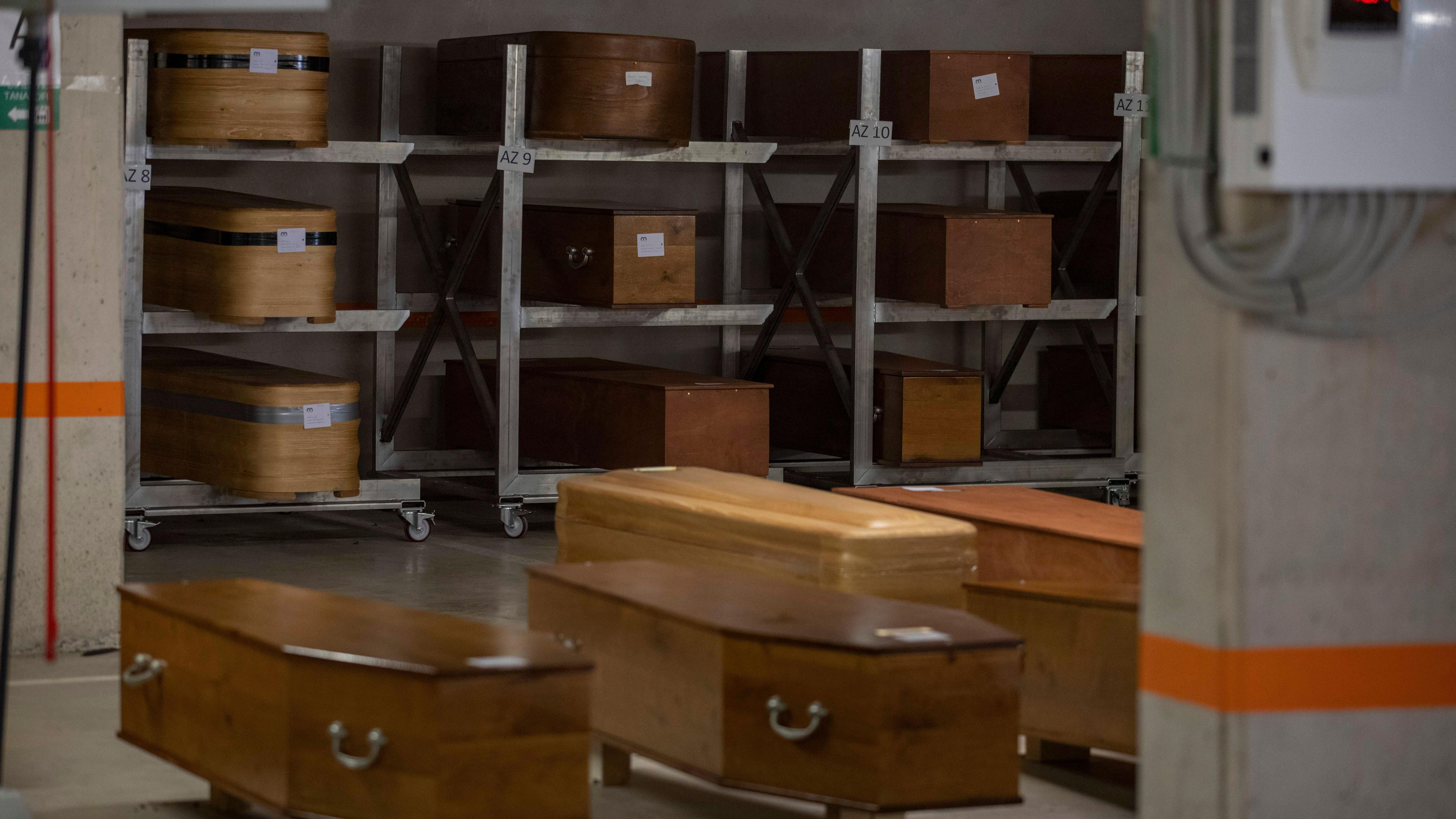 File photo of a stack of coffins in a mortuary