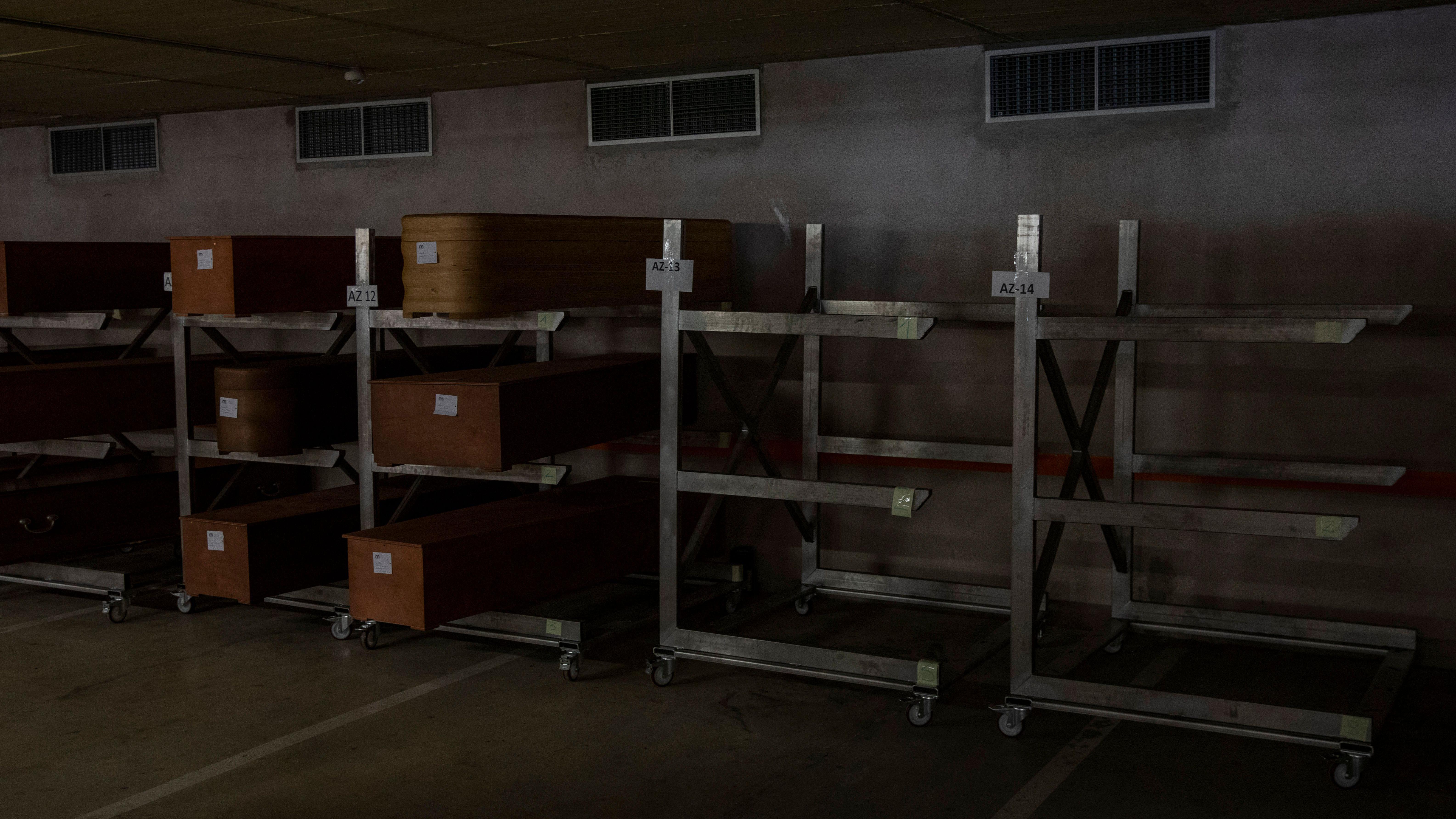 file photo of a morgue with coffin stacks 