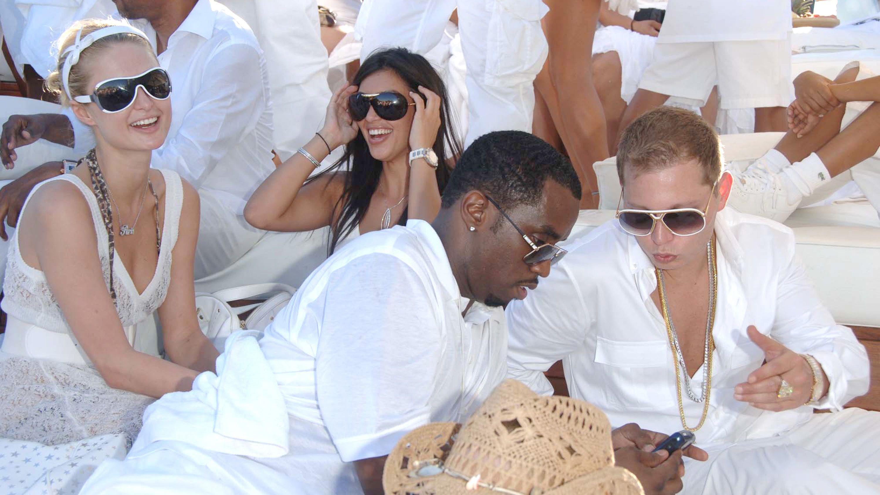 Paris Hilton, Kim Kardashian and Sean "Diddy" Combs inside photo during di 2006 White Party event. 