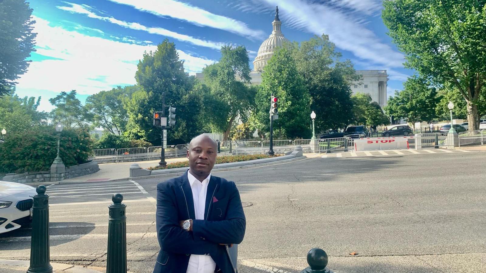 Dr Yves Kaduli, a 38-year-old asylum seeker from di Democratic Republic of Congo stand in front of di White House