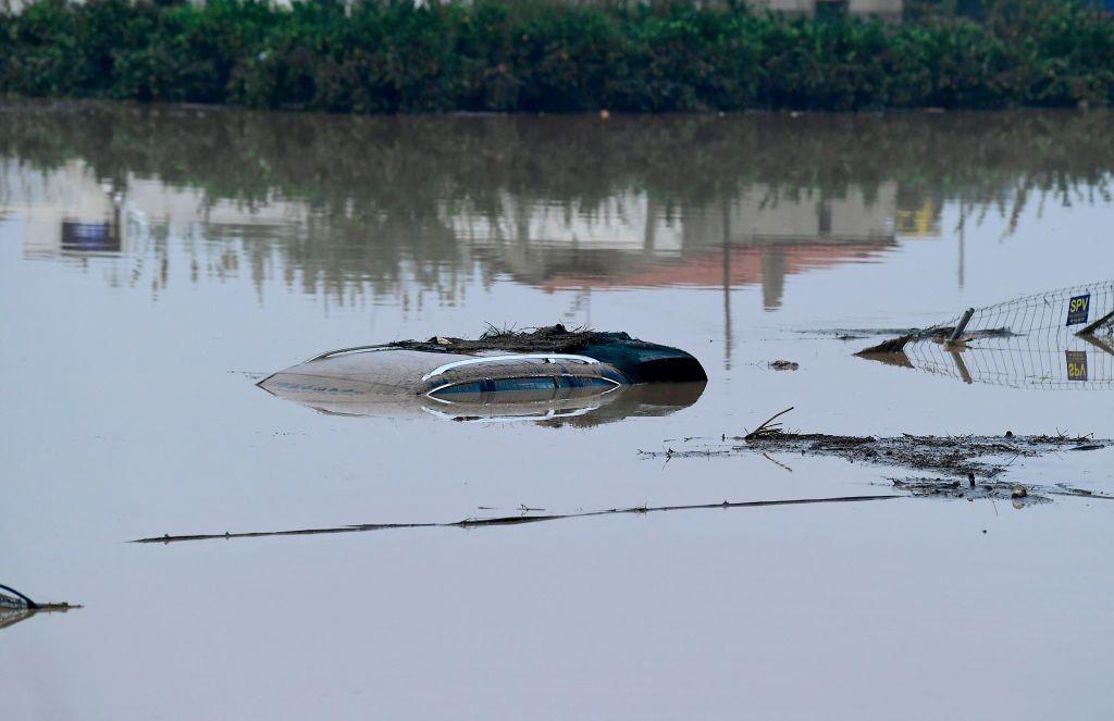 A car roof sticks up out of flood waters